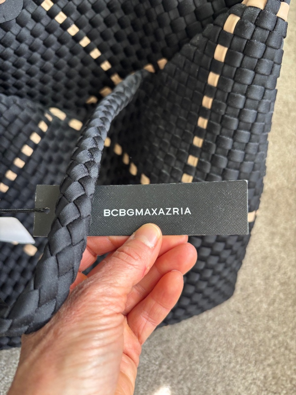 Black and tan woven summer tote with mini bag inside